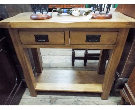 A heavy light oak side table fitted 2 drawers, 2'9" wide 