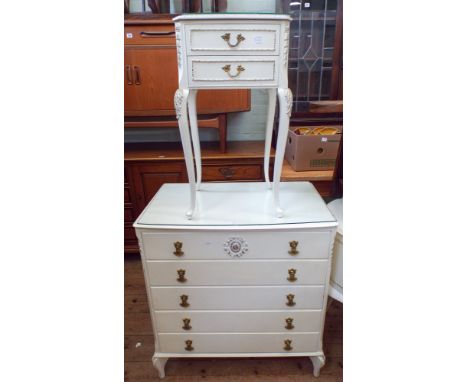 A white and gilt kidney shaped dressing table, matching chest of five drawers and a bed side cabinet 