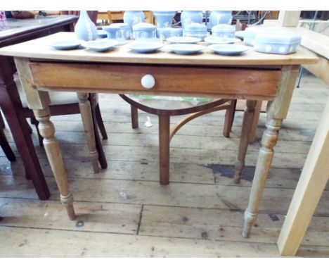 A Victorian stripped pine bow front side table, fitted drawer on turn legs. 3' wide 