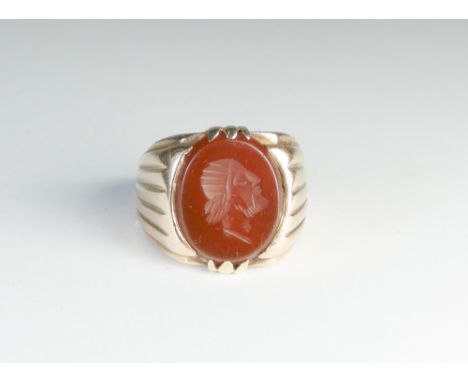 Gents intaglio panel ring, set with a carved hardstone depicting portrait of Hermes, unmarked shank tests as gold. Weight 9.9