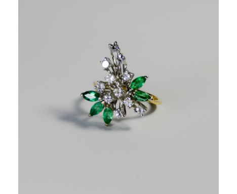 An 18ct yellow gold emerald and diamond cluster ring, set with five marquise shaped emeralds and brilliant cut diamonds in a 