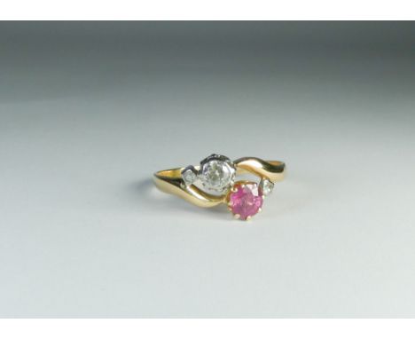 Two stone ruby and diamond cross over design ring, ring size U