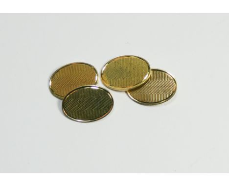Pair of gents 18ct yellow gold oval cufflinks with engine turned decoration, hallmarked, gross weight 11.5 grams.