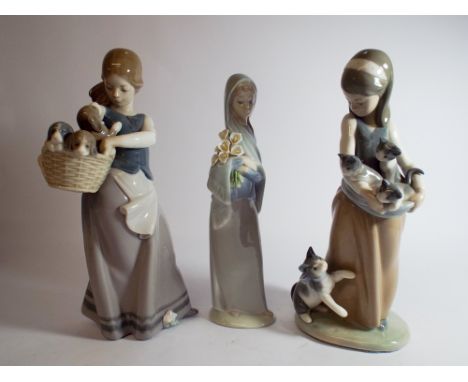Three Lladro porcelain figurines of girls two holding baskets of puppies and kittens 