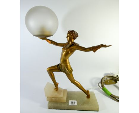 A 1930's Art Deco lamp of a dancing lady holding a frosted globe standing on a onyx base, together with a spare globe, overal