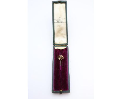 Ladies 9ct Gold Ruby set scroll stick pin in fitted case 