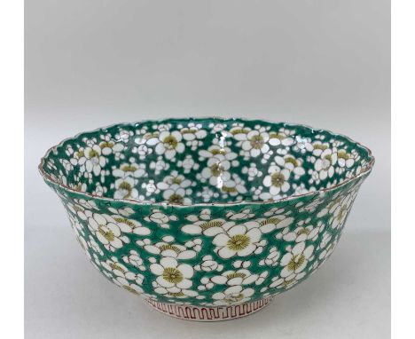 CHINESE FAMILLE VERTE PORCELAIN DEEP BOWL, Kangxi or later, painted inside and out with prunus blossom on emerald green 'crac