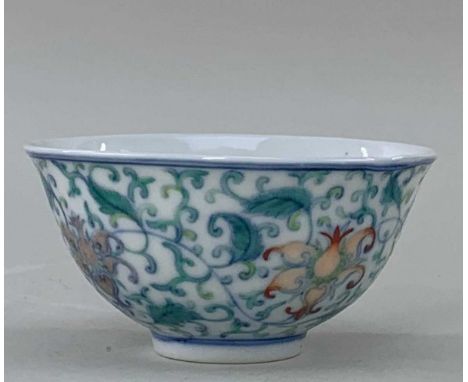 CHINESE DOUCAI PORCELAIN TEA BOWL, Xianfeng six-character mark, outside painted with continuous band of four scrolling lotus 