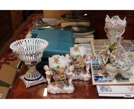 Pair of European Cherub decorated floral vases and 2 other Ceramic vases 