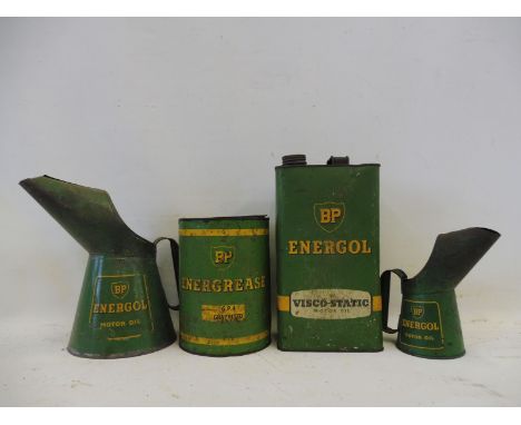 A BP Energol half gallon oil measure, a matching pint measure and two matching cans. 
