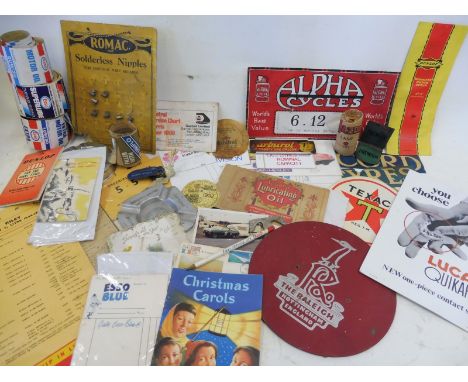 A collection of assorted motoring related ephemera to include Esso stickers, a Lucas showcard and a Shell Robotman booklet et