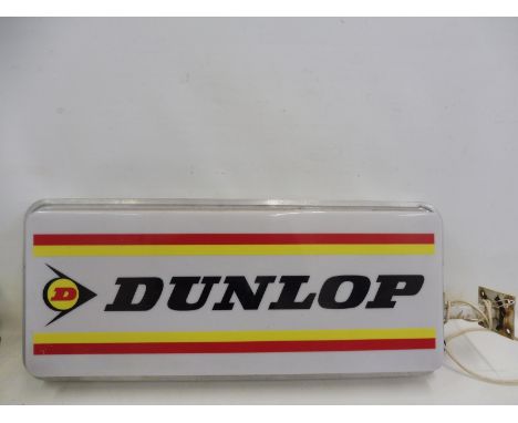 A Dunlop illuminated lightbox set within an aluminium frame, 38 1/2" wide x 15 3/4" high x 4 1/4" deep.