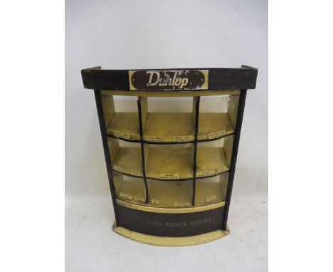 An unusual Dunlop counter top semi-circualar display cabinet of wooden and perspex construction.