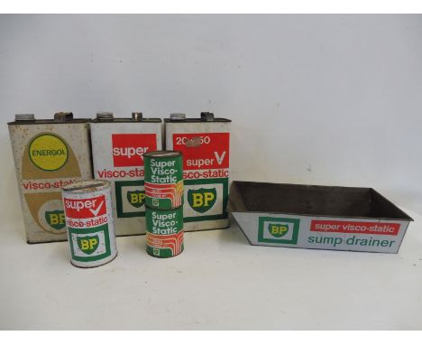 Three BP Visco-Static gallon cans, a matching sump drainer and three oil cans. 