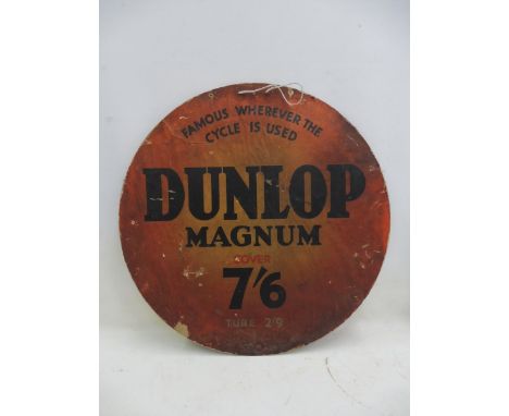 A Dunlop Magnum circular cardboard sign, 26" diameter.