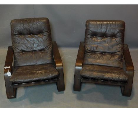 Two mid century teak lounge chairs, with brown leather button back seats, H.74 W.75 D.92cm 