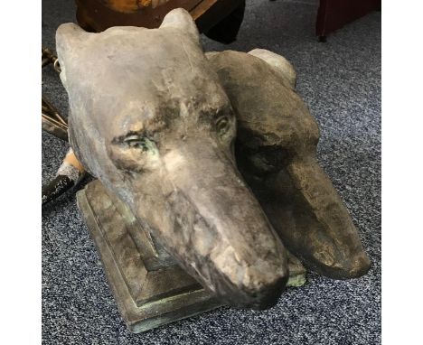 A 'bronzed' and patinated ceramic sculpture of two racing Greyhound heads, on integral plinth, 28x45cm 