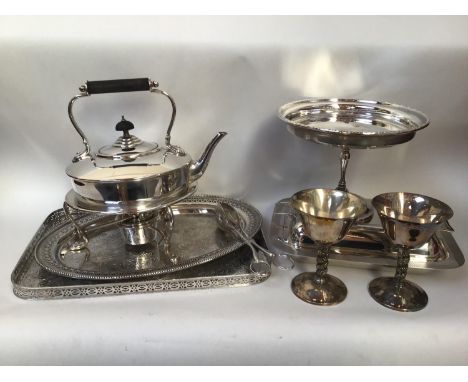 A quantity of silver-plated items including two trays, spirit kettle, tureen and cover, bonbon dish and two goblets 