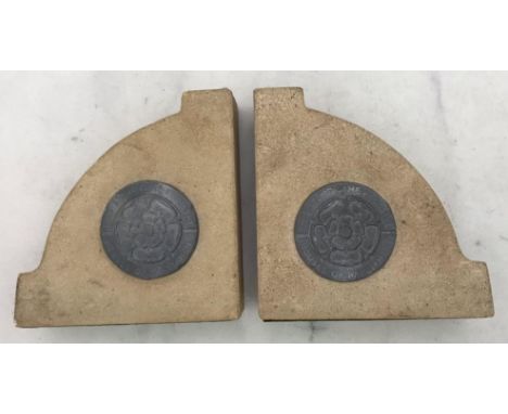 A pair of sandstone quadrant bookends with mounted Tudor Rose roundels 'This Stone is from The Houses of Parliament,' togethe