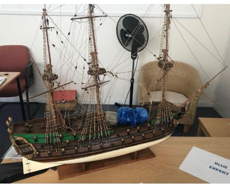 A hand-built painted wooden scale model of a fully-rigged 18th century 64-gun ship-of-the-line, on wooden display stand, 92cm