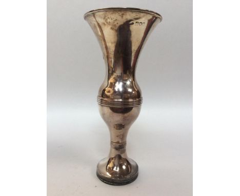 A silver spill vase with reeded flared rim, reeded globular knop, on loaded circular spreading foot, 21cm high, London, 1909,