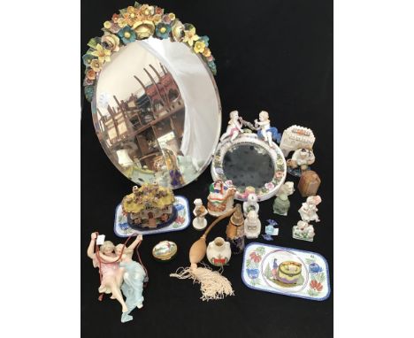 A quantity of ceramics including a Sitzendorf mirror with cherubs atop (af), a small Sitzendorf dog, Staffordshire pottery ho