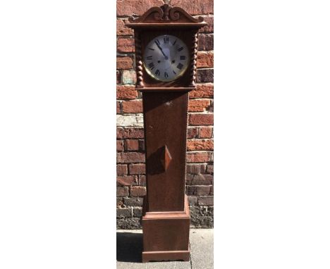 An oak cased grandmother clock with shaped finial, silvered dial with Roman numerals, the hood with spiral pilasters, the cas