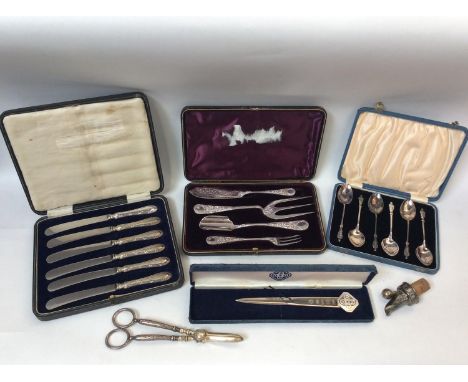 A boxed Y2K silver letter opener and cased set of butter knives with silver handles, together with silver-plated dessert serv