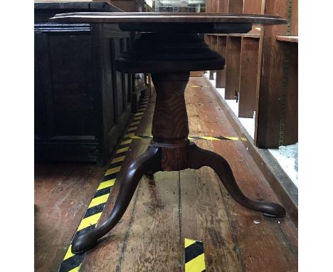 A circular oak tripod table with 'Lazy Susan' rotating top, 70cm diam, together with a Liberty 'style' stained beechwood stic