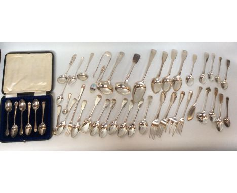 A quantity of Georgian, Victorian and later silver flatware, spoons, forks, including pickle fork, serving fork, various Fidd