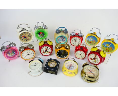 A collection of vintage alarm clocks to include Mickey Mouse, The Flintstones and similar. [W]