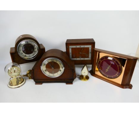 A collection of clocks to include mantel clocks and a torsion clock. [W]