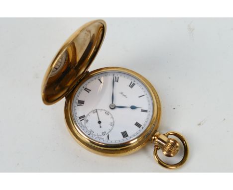 A gold plated full hunter pocket watch, Roman numerals to a white enamel dial, subsidiary seconds dial, 5 cm (d) case. [W]