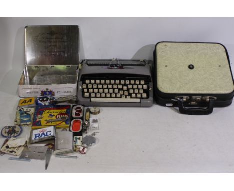 Mixed collectables to include penknives, car badges, Robertsons advertising patches, hip flask, portable typewriters and othe