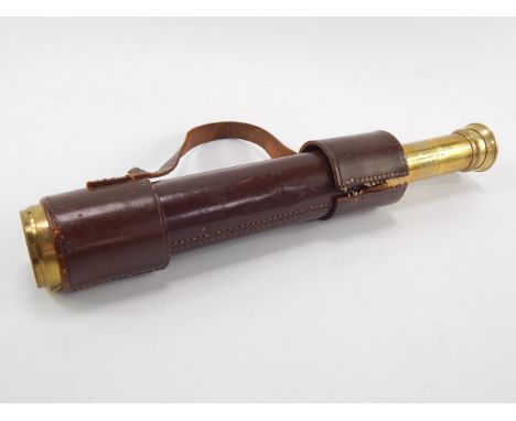 A Broadhurst Clarkson & Co Ltd brass and leather bound four drawer telescope, 83cm long fully extended.