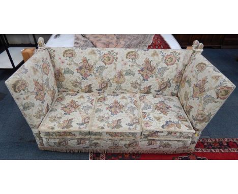 A Knowle three seater sofa, upholstered in a floral patterned fabric, 187cm long.