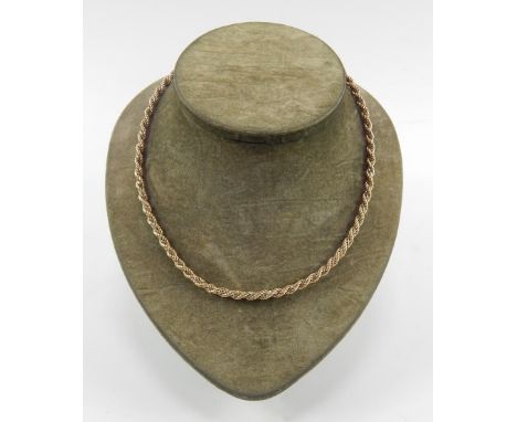 A 9ct gold bi-colour rope twist chain, on a bolt ring clasp, 12.4g.