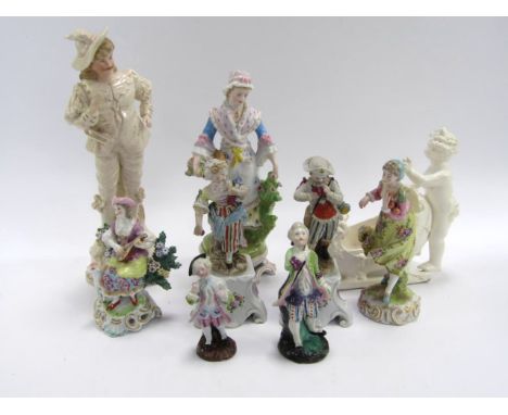 A Samson Chelsea porcelain figure of a woman playing a lute, 14cm high, a pair of French bisque figures, on integral stands, 