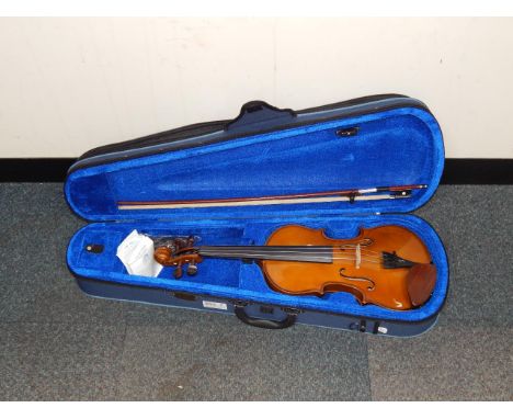 A Stentor student's violin, cased with a bow.