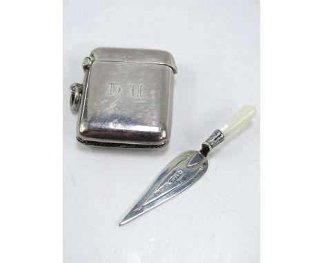 A George V silver vesta case, intialled DH, Birmingham 1919, 1oz, and an Edwardian silver and mother of pearl trowel bookmark