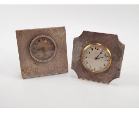 A George V silver bedside clock, silvered dial bearing Arabic numerals, eight day movement, engine turned fascia, Birmingham 