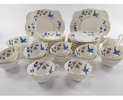 A Tuscan China early 20thC porcelain tea service, decorated in the Bluebird pattern, comprising cream jug, sugar bowl, pair o