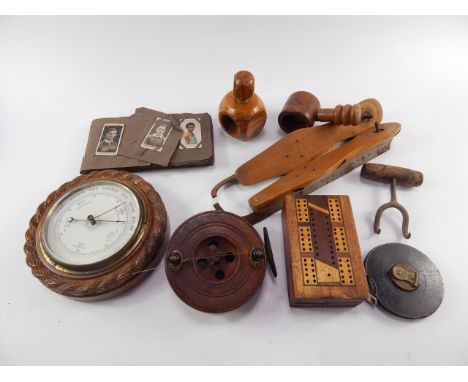 A wooden and brass fishing reel, 13.5cm diameter, a pair of ice skates, cribbage board, John Rabone & Sons metal tape measure