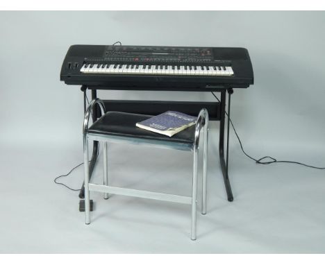 A Yamaha Portatone electric keyboard, PSR-5700, with manual, and stool.