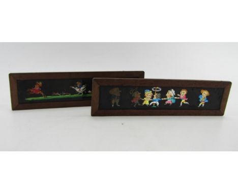 Two Victorian magic lantern slides, 26cm long.