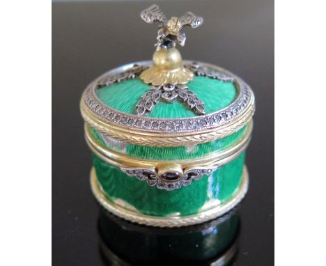 A Russian Silver Gilt, Guilloché Enamel and Jewelled Box in original presentation case, set with rose cut diamonds and caboch