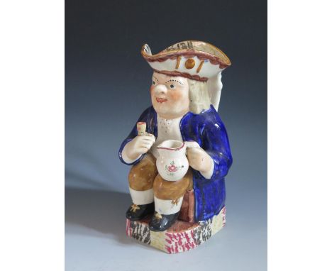 A Nineteenth Century Prattware Toby Jug, 26cm, replacement cup glued to hand, crazing 