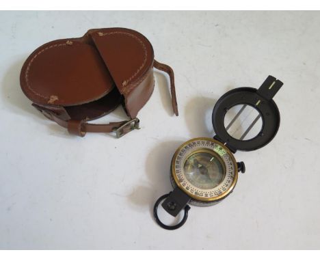 A Post WWII Marching Compass in leather pouch, no markings 