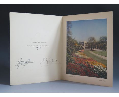 An Official 1951 Royal Christmas Card signed George and Elizabeth and showing a photographic print of Buckingham Palace garde