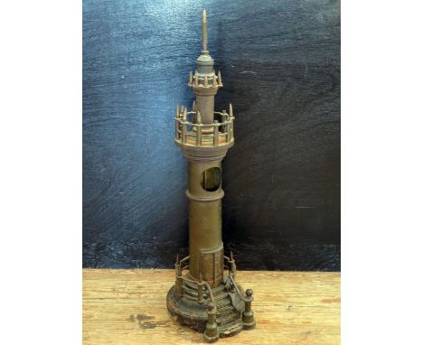 A Trench Art 'Working Model' Light House with cog driven mechanism, 75cm high. Model with parts missing and mechanism not com